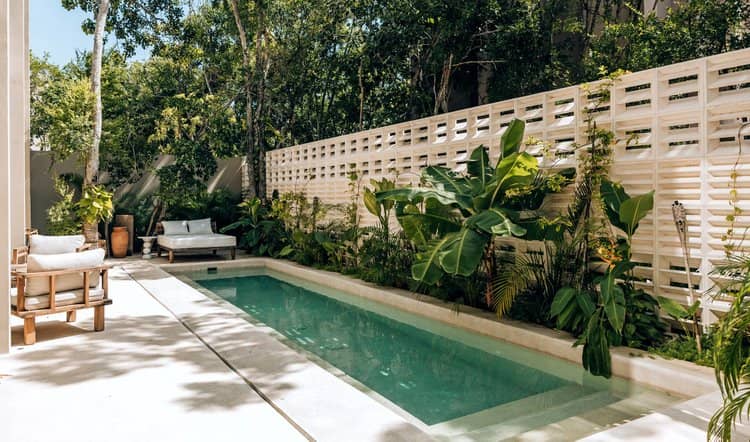 Lap pool and patio of a Tulum Airbnb listing under active operations