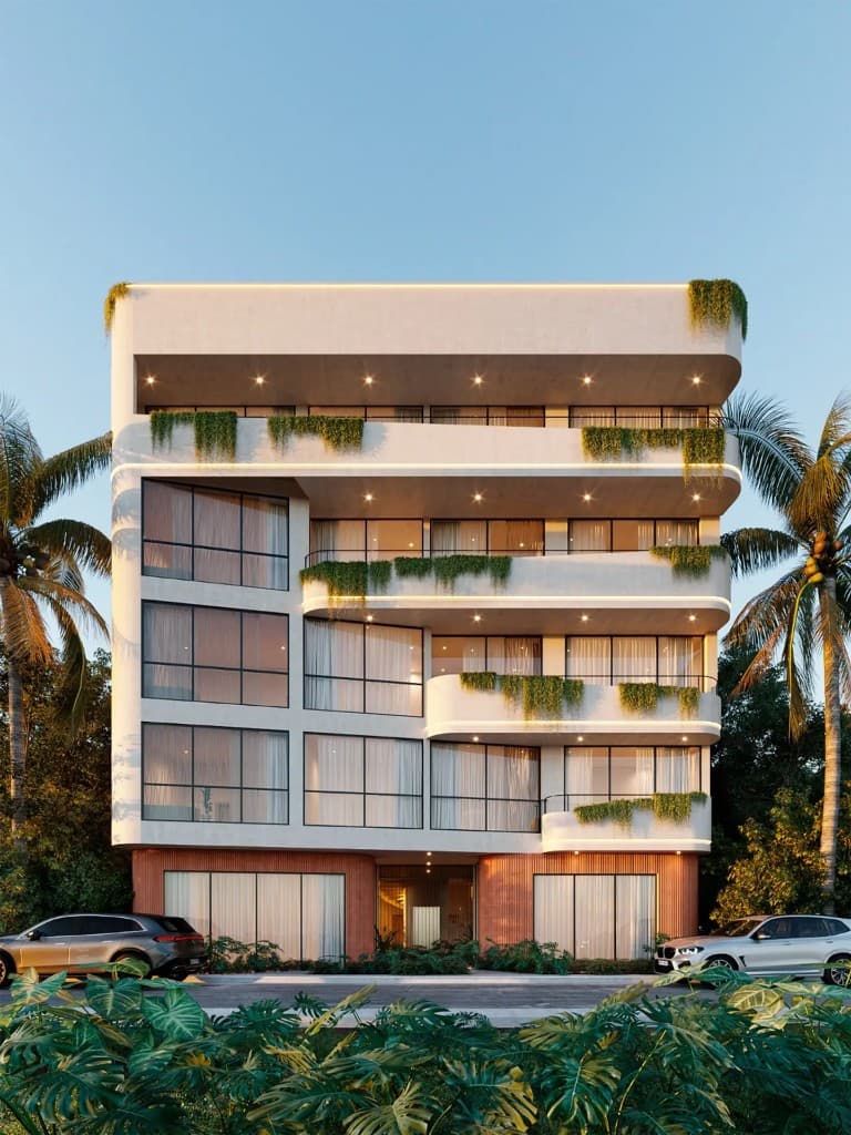 The Curve Tulum exterior with curved balconies and tropical landscaping in Aldea Zama