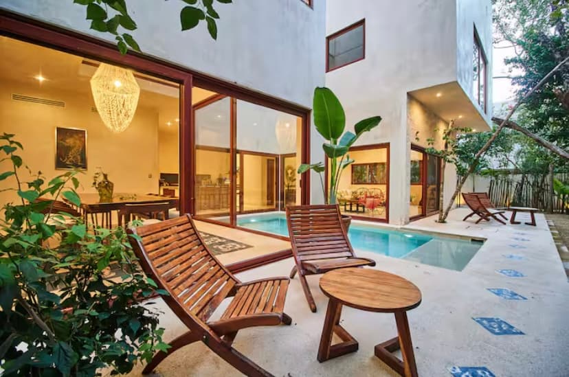 Evening pool and lounge chairs at a rental villa