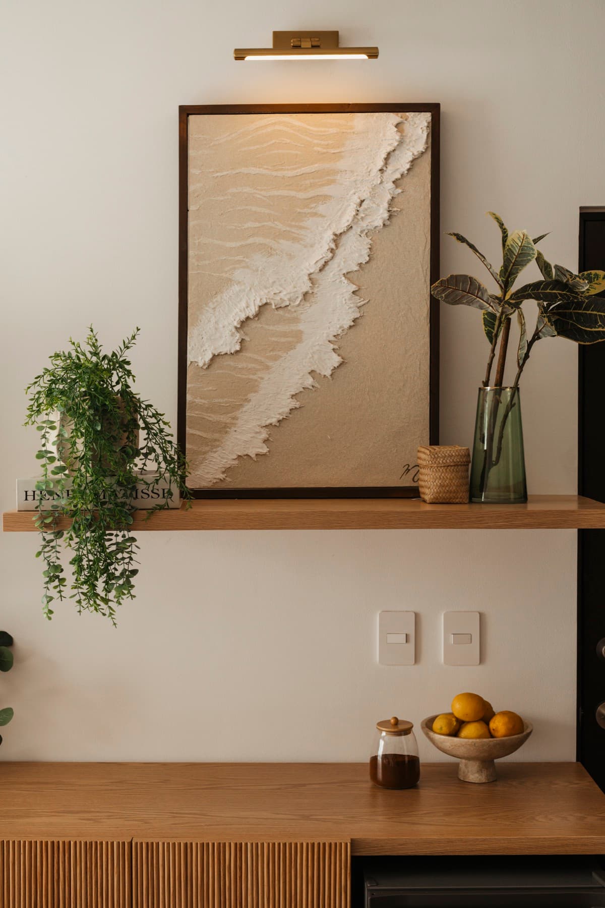 Ceiba at 25 kitchen counter with wave artwork and lemons