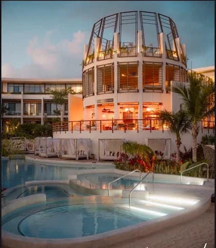 Artia Condos amenities at twilight with illuminated pools