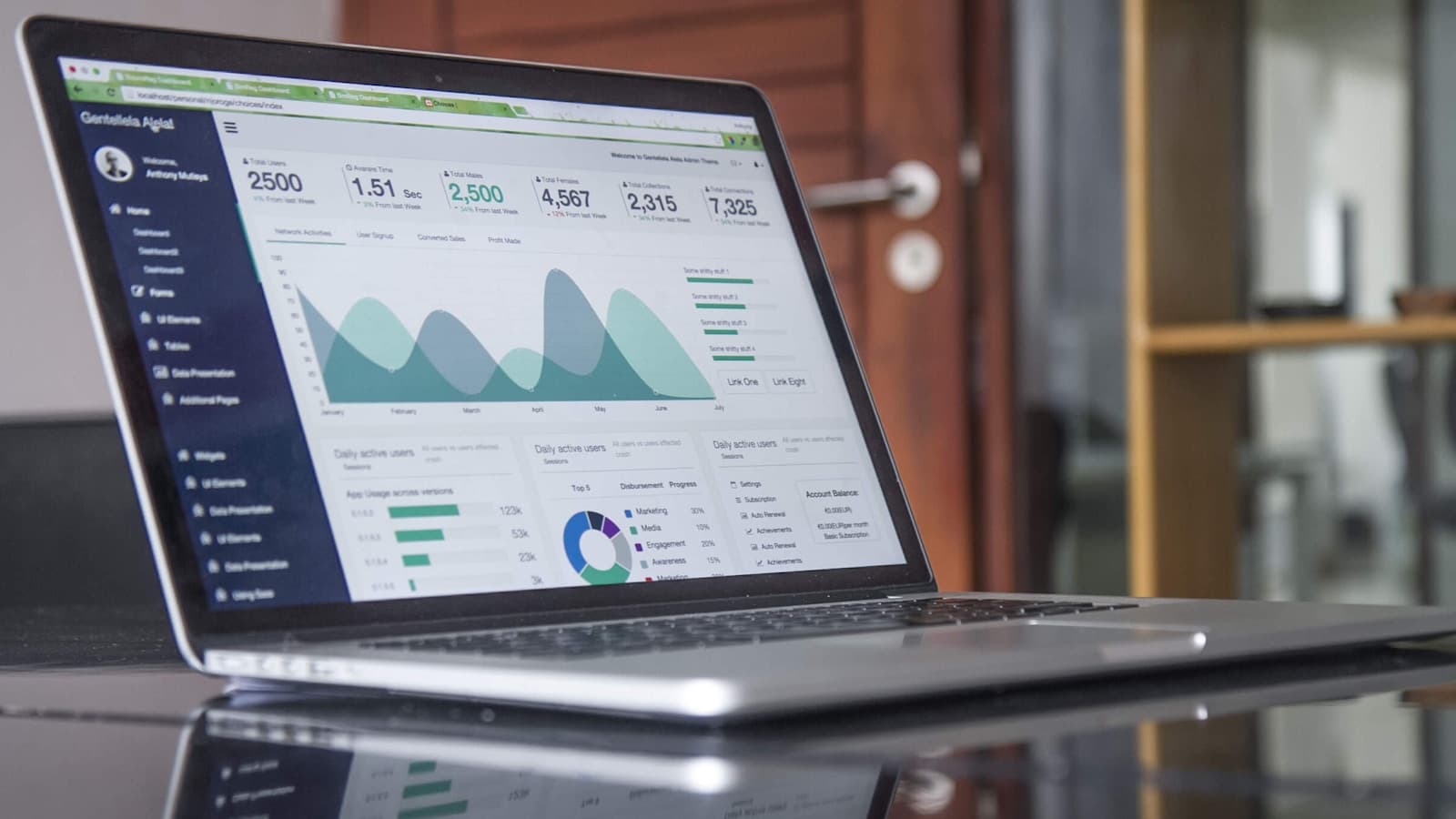 Owner reviewing pricing data on a laptop — seasonal pricing isn